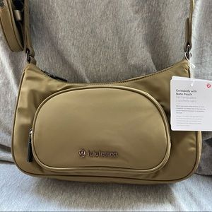 Olive green Lululemon crossbody with pouch. New with tags. Never been used.